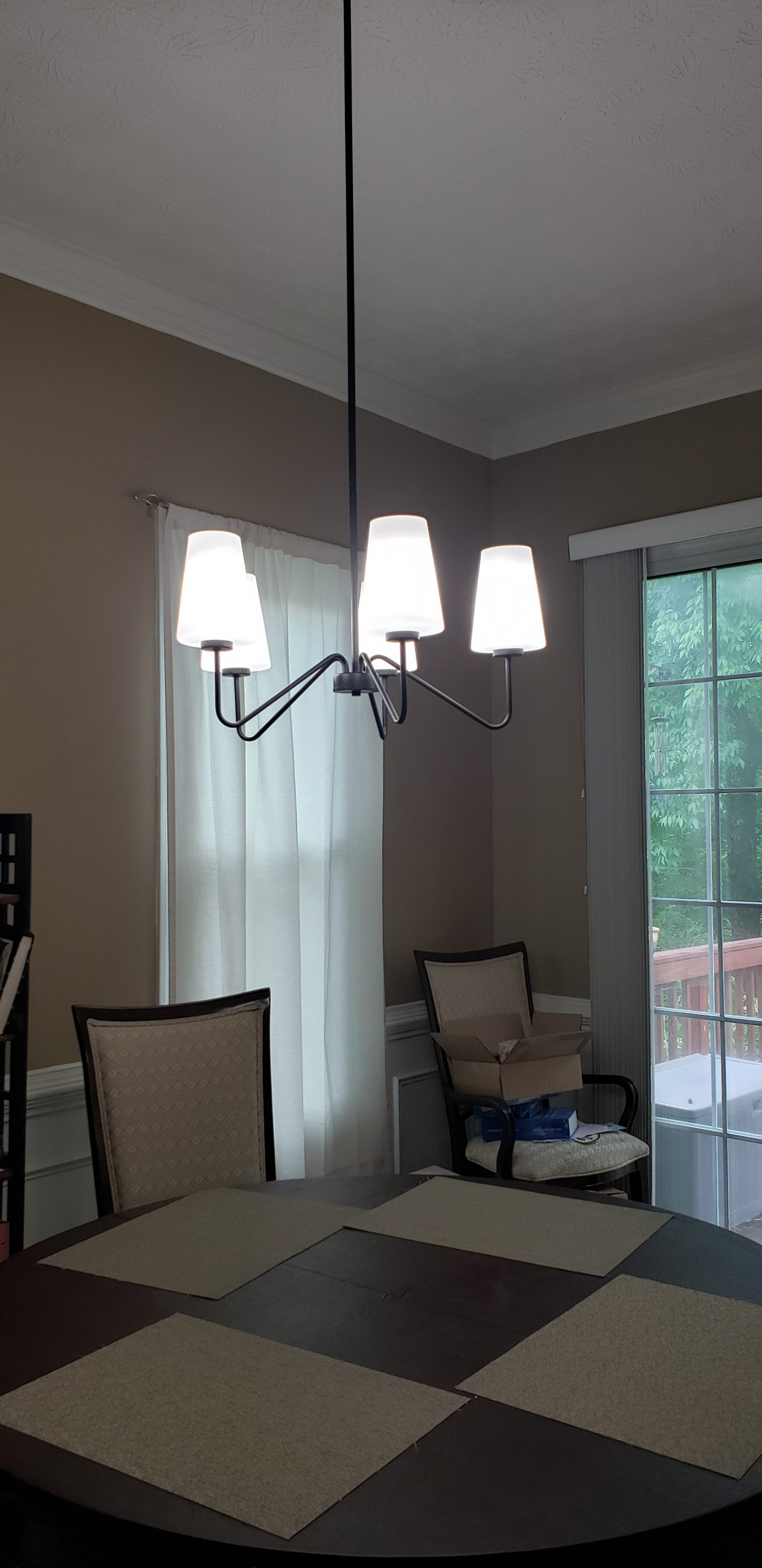 After: A sleek, chic black chandelier with conical white shades. It gives bright light to the entire area. - Lighting Makeover: Our Lights in a Real Home (My Home!) - LightsOnline.com Blog